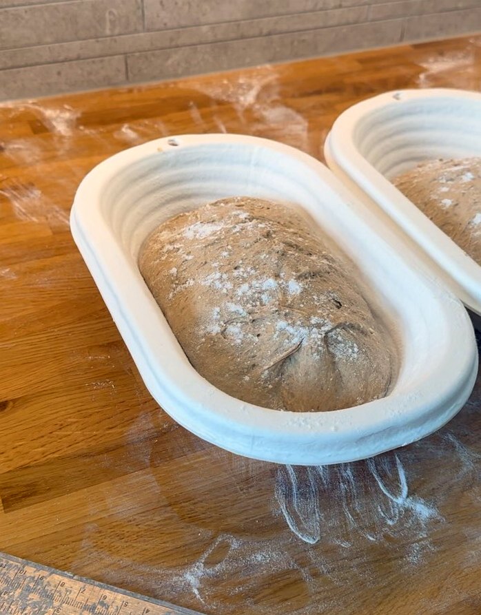 Sourdough proving in bannetons, dusted with flour